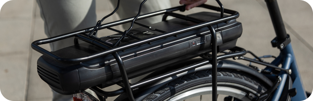 Closeup of the seat of an ebike with battery