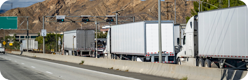 Trucks line up at a weigh station