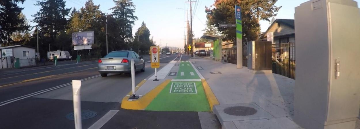 shared-use bus platform that incorporates a sidewalk-level bike lane