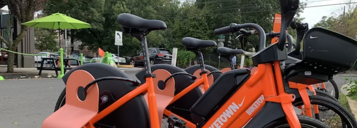 New electric bikes docked at a BIKETOWN bike share station in Portland, Oregon