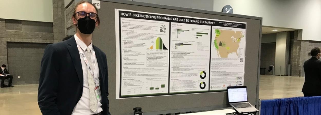 PSU student Cameron Bennett at his e-bike poster at TRB 2022