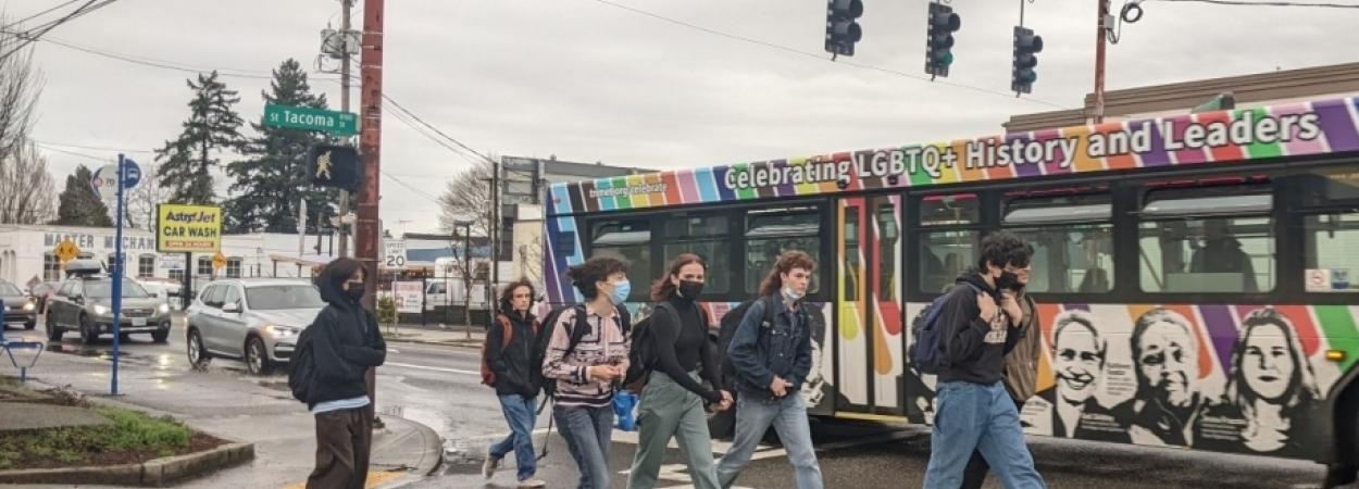 Pedestrians and Bus seen from inside Car