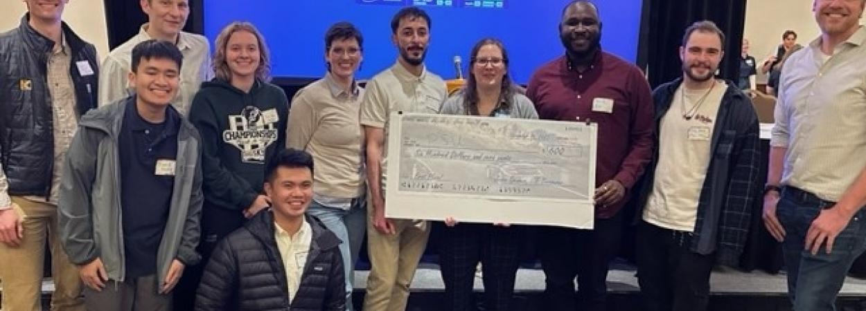 This picture shows the team, fellow PSU students, and ITE leaders with their $600 winner's check.