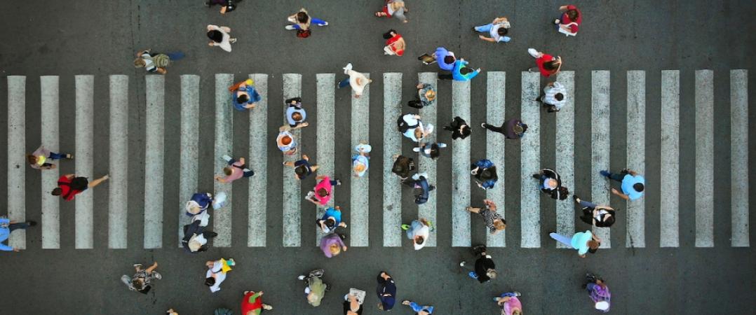 pedestrians cross the street