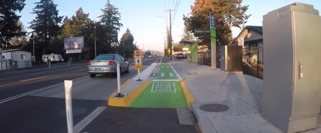 shared-use bus platform that incorporates a sidewalk-level bike lane