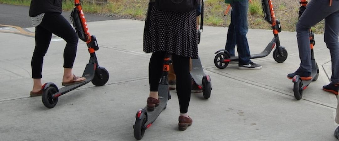 Comparing the Promise and Reality of E-Scooters: A Critical Assessment of Equity Improvements and Mode-Shift