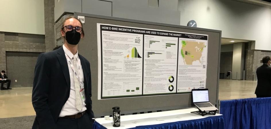 PSU student Cameron Bennett at his e-bike poster at TRB 2022