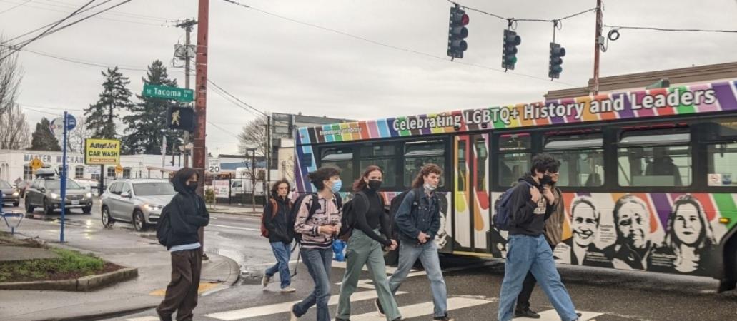 Pedestrians and Bus seen from inside Car